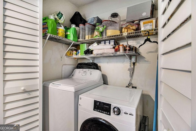 washroom featuring laundry area and washing machine and clothes dryer