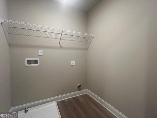 laundry room with laundry area, baseboards, wood finished floors, washer hookup, and electric dryer hookup