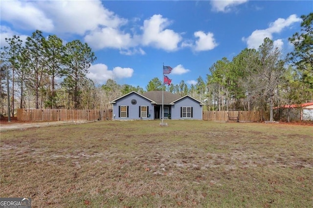 single story home featuring fence and a front lawn