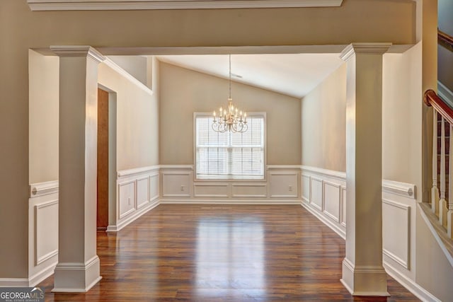 unfurnished dining area featuring a chandelier, vaulted ceiling, and ornate columns