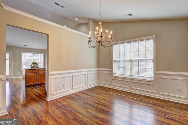 unfurnished dining area with lofted ceiling, visible vents, a chandelier, and dark wood finished floors