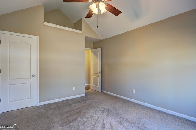 unfurnished bedroom featuring high vaulted ceiling, baseboards, a ceiling fan, and light colored carpet