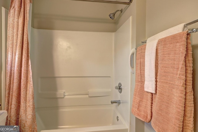 full bathroom with shower / bath combo with shower curtain