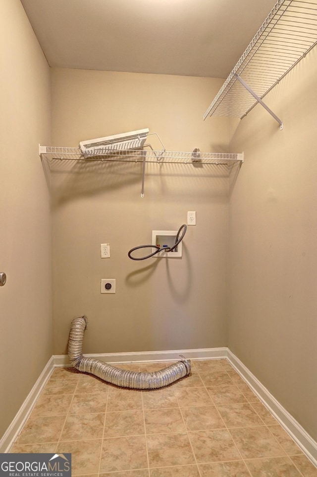 laundry area with hookup for a washing machine, laundry area, hookup for an electric dryer, and baseboards