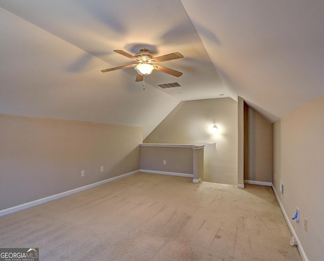 bonus room featuring ceiling fan, baseboards, visible vents, and vaulted ceiling