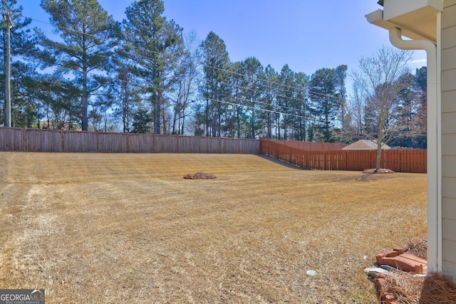 view of yard featuring a fenced backyard