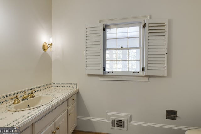 bathroom featuring visible vents and vanity