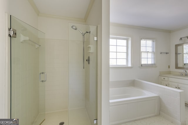 bathroom with a bath, a stall shower, crown molding, and vanity