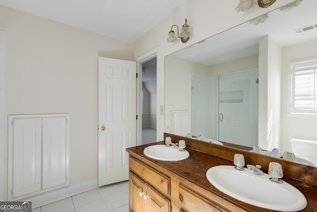 full bathroom featuring a shower stall, visible vents, a sink, and tile patterned floors