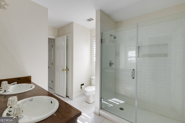 full bath featuring double vanity, tile patterned flooring, a sink, and visible vents