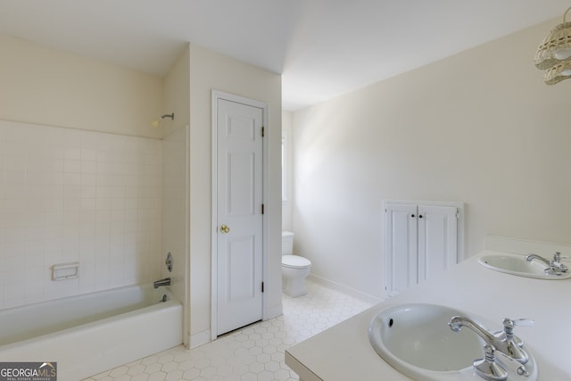 full bathroom with shower / bathtub combination, a closet, a sink, and toilet