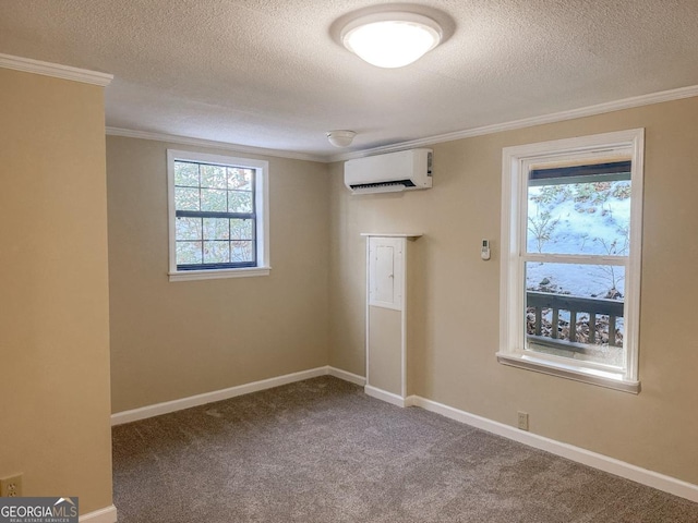 empty room featuring carpet, crown molding, baseboards, and an AC wall unit