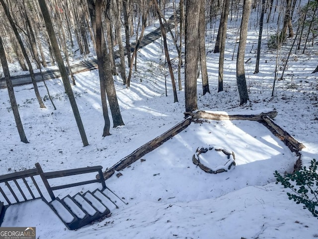 view of yard layered in snow