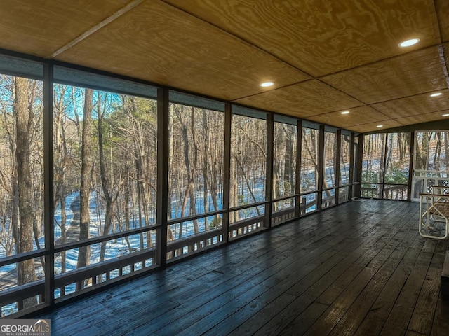 unfurnished sunroom featuring wooden ceiling