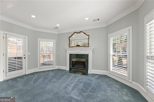 unfurnished living room featuring carpet floors, ornamental molding, plenty of natural light, and visible vents