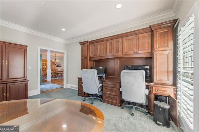 carpeted office with ornamental molding, a wealth of natural light, baseboards, and an inviting chandelier