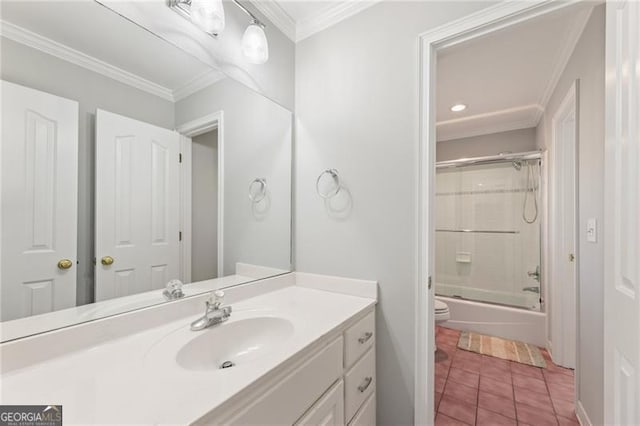 full bath featuring toilet, bath / shower combo with glass door, vanity, tile patterned floors, and crown molding