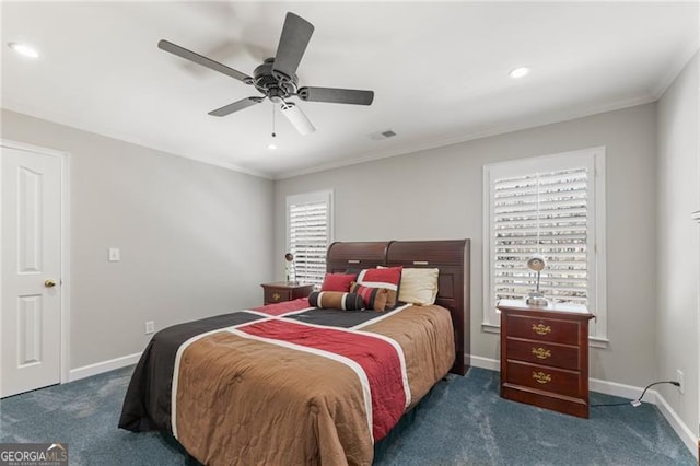 bedroom featuring dark colored carpet, ornamental molding, and baseboards