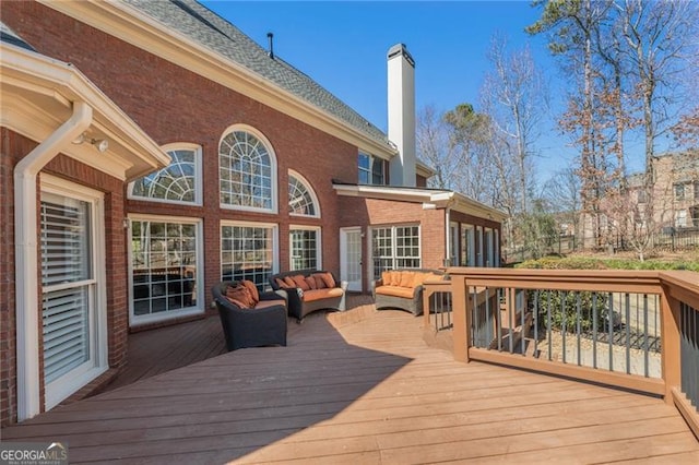 deck with an outdoor hangout area