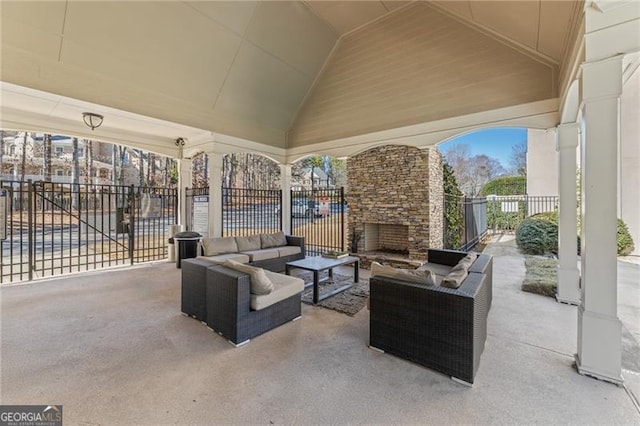 view of patio featuring fence and an outdoor hangout area