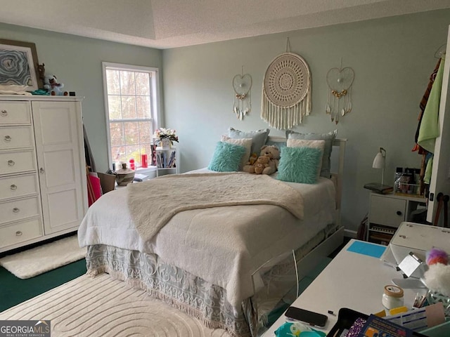 bedroom featuring a textured ceiling