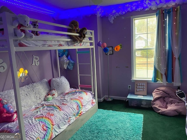 carpeted bedroom featuring multiple windows