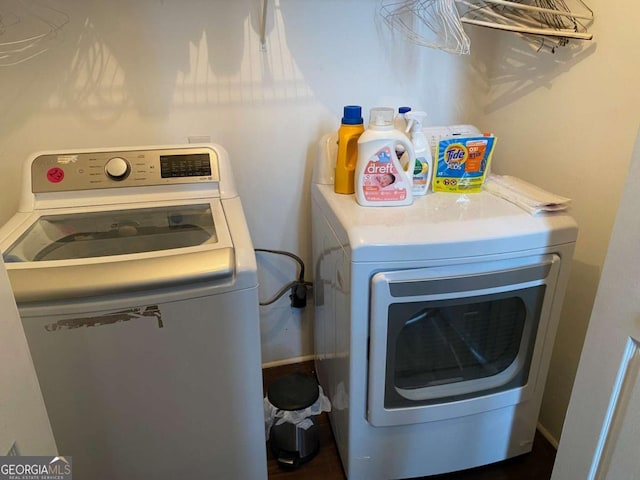 clothes washing area with washer and dryer and laundry area