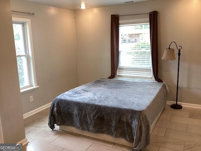 1141 N Clark St, Milledgeville, GA 31061 - bedroom featuring visible vents, baseboards, and light tile patterned floors