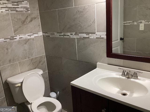 1141 N Clark St, Milledgeville, GA 31061 - bathroom featuring tile walls, vanity, and toilet