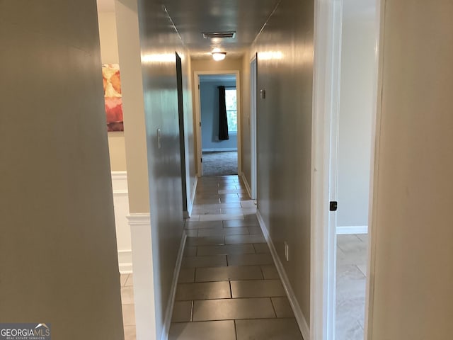 1141 N Clark St, Milledgeville, GA 31061 - corridor with visible vents, dark tile patterned floors, and baseboards