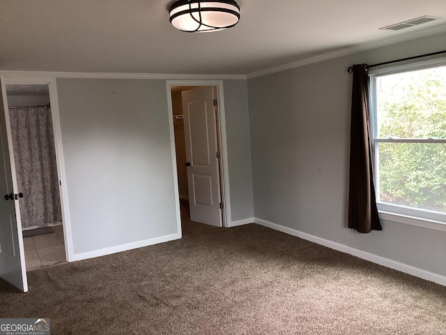 1141 N Clark St, Milledgeville, GA 31061 - spare room with a healthy amount of sunlight, visible vents, carpet flooring, and ornamental molding