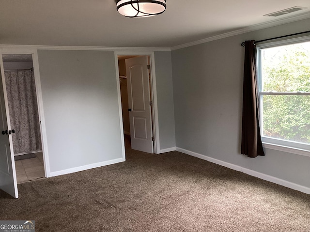 1141 N Clark St, Milledgeville, GA 31061 - carpeted spare room with a wealth of natural light, visible vents, crown molding, and baseboards