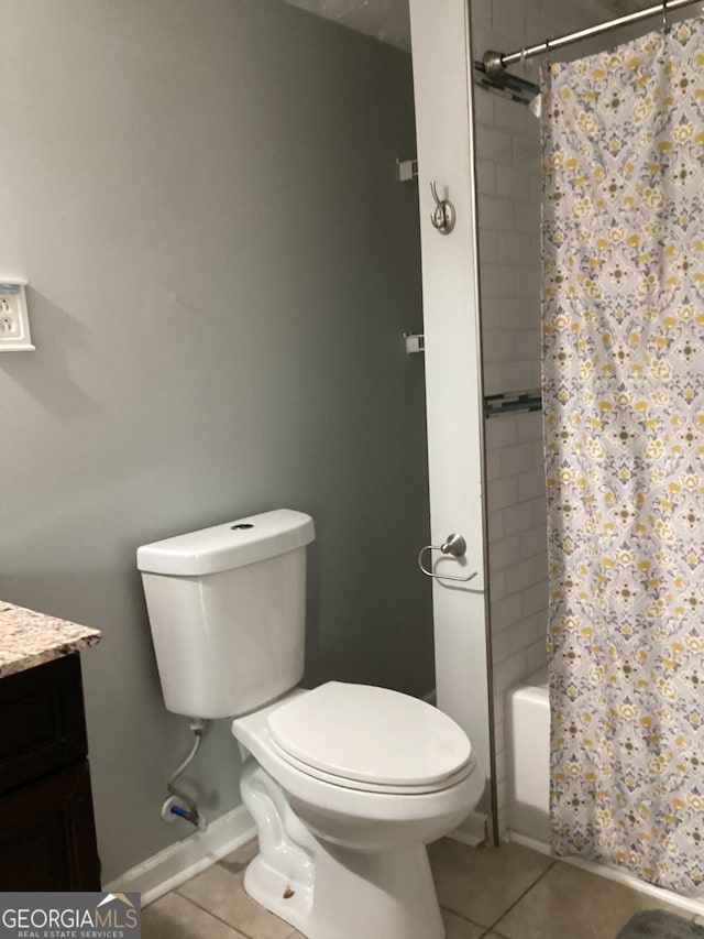 1141 N Clark St, Milledgeville, GA 31061 - bathroom with baseboards, vanity, toilet, and tile patterned floors