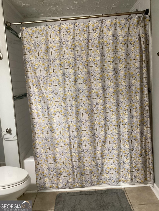 1141 N Clark St, Milledgeville, GA 31061 - bathroom with tile patterned flooring and toilet