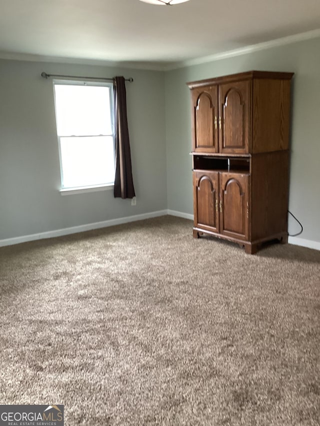 1141 N Clark St, Milledgeville, GA 31061 - interior space featuring crown molding, baseboards, and carpet flooring