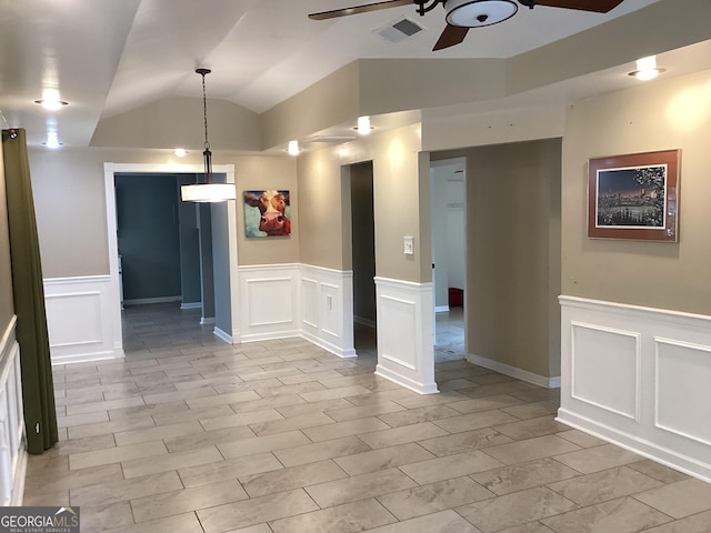 1141 N Clark St, Milledgeville, GA 31061 - empty room featuring visible vents, a ceiling fan, lofted ceiling, wood finish floors, and a decorative wall