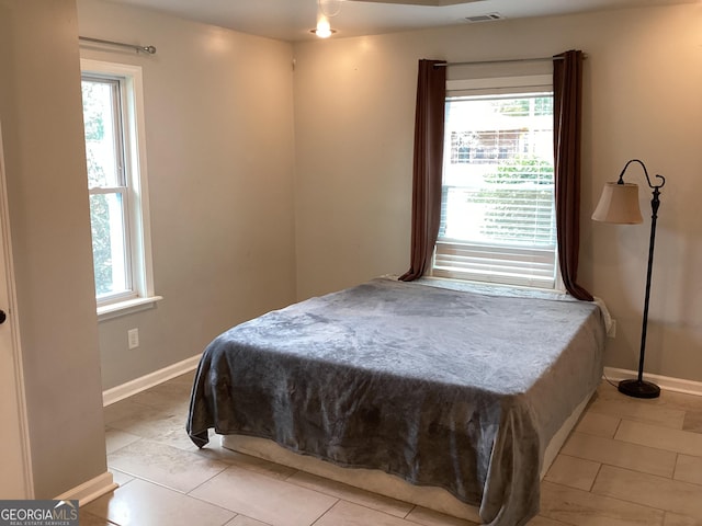 1141 N Clark St, Milledgeville, GA 31061 - bedroom with baseboards, multiple windows, and visible vents