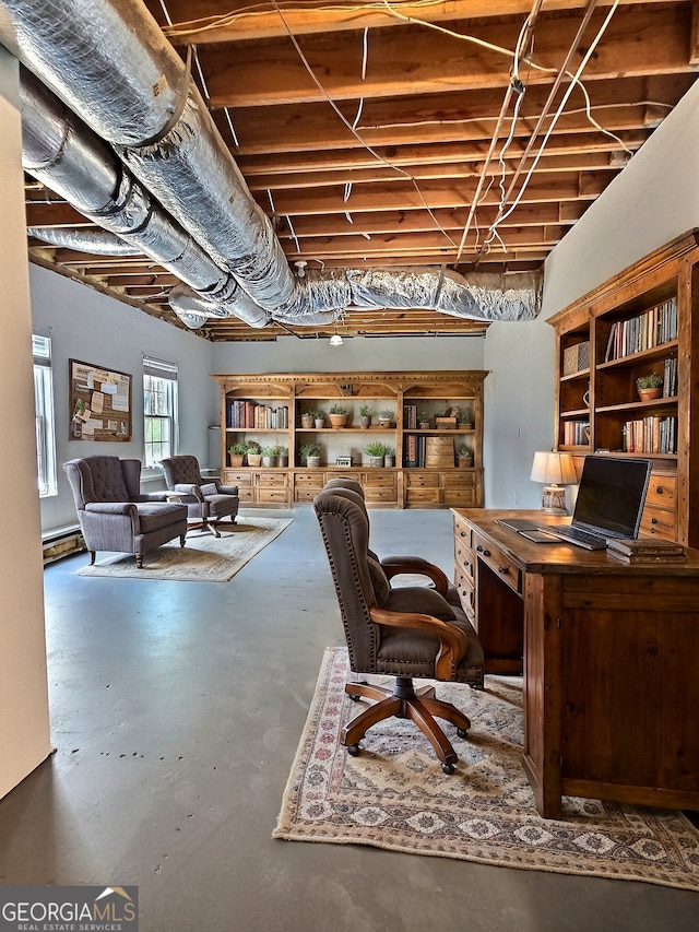 office space with finished concrete floors and a baseboard radiator