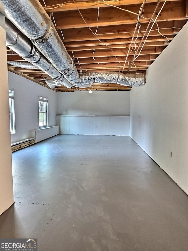 basement featuring baseboard heating