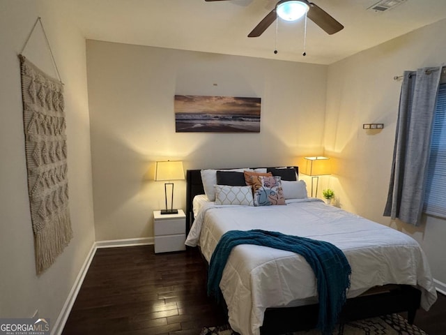 bedroom with wood-type flooring, visible vents, ceiling fan, and baseboards