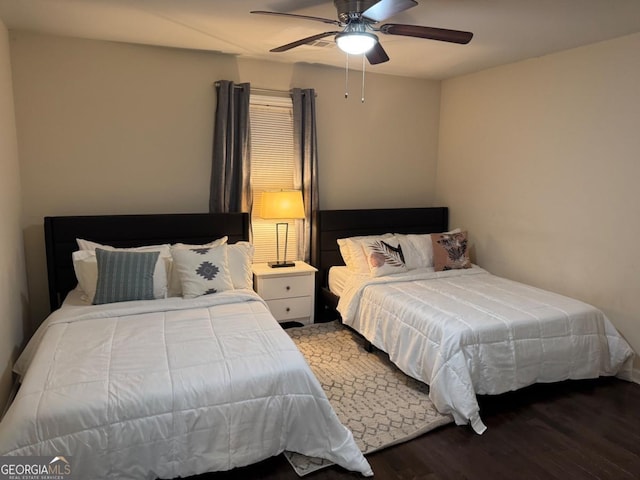 bedroom featuring ceiling fan and wood finished floors