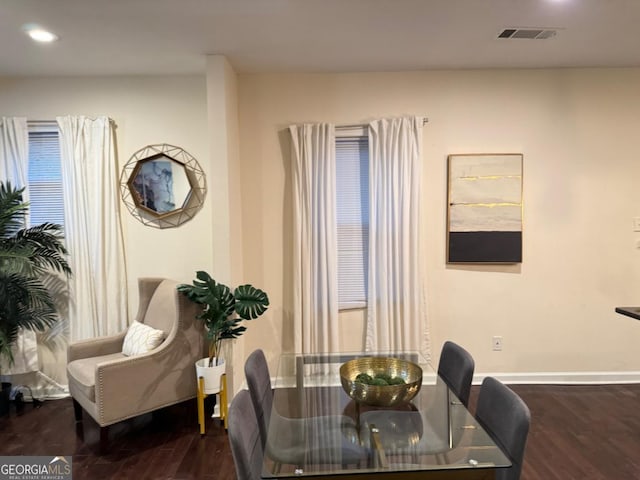 dining space featuring baseboards, visible vents, wood finished floors, and recessed lighting