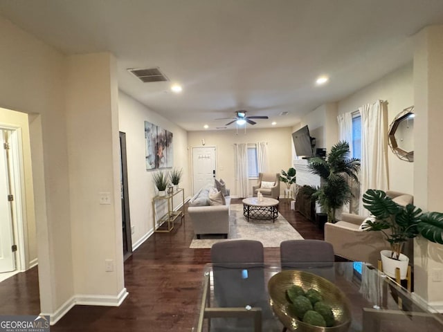 living room with ceiling fan, visible vents, dark wood-style flooring, and recessed lighting