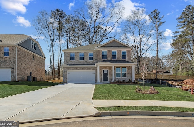 view of front of home featuring brick siding, fence, concrete driveway, a front yard, and a garage