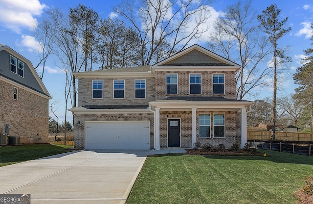 view of front facade featuring brick siding, an attached garage, fence, a front yard, and driveway