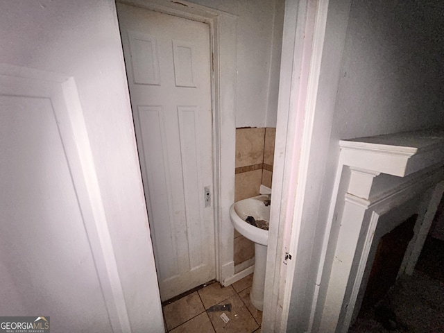 bathroom with tile patterned floors