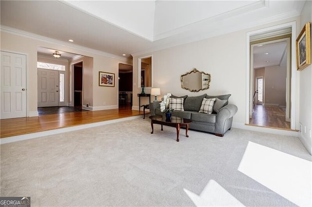 carpeted living area with baseboards, ornamental molding, and recessed lighting