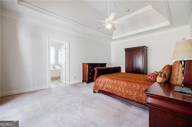 bedroom with baseboards, a raised ceiling, crown molding, and carpet flooring