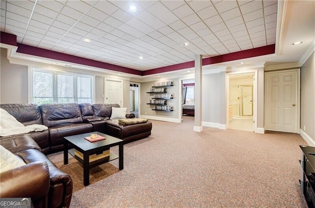 carpeted living area with crown molding, recessed lighting, a raised ceiling, and baseboards