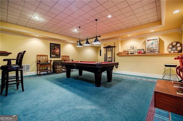 game room with carpet, a raised ceiling, visible vents, ornamental molding, and baseboards